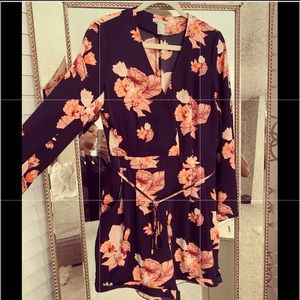 Beautiful navy blue w/floral print romper